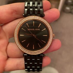 Michael Kors black and gold woman’s watch